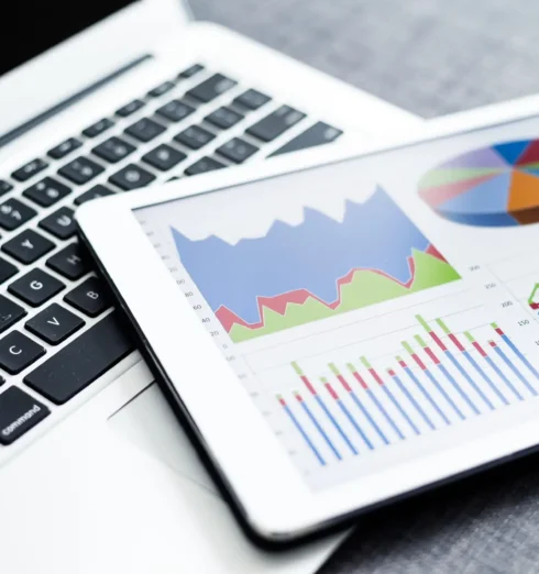 Business charts and diagrams on digital tablet